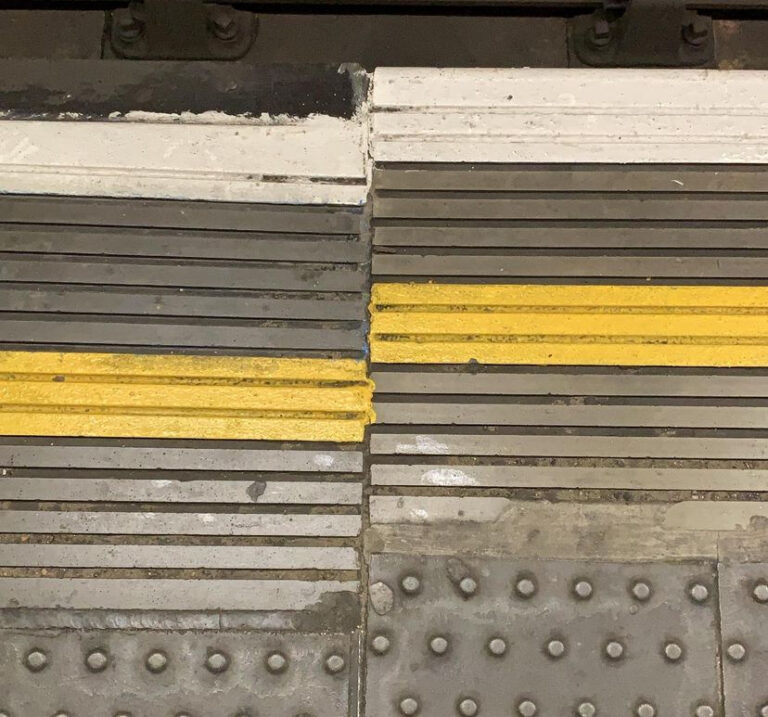 Yellow lines on the London underground platform